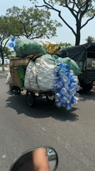 Motorbike rider transports heavy load through Đà Nẵng streets