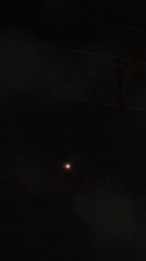 Dim yellow light observed moving across night sky in Israel