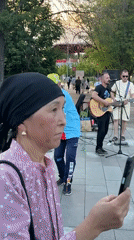 Street band performs in Moscow park as dancer entertains