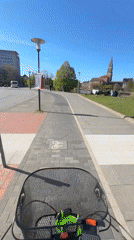 Cyclist in white hoodie recorded during morning ride in Kiel
