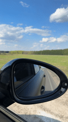 Car drives through Russian countryside near Saitovo