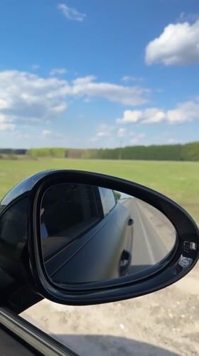Car drives through Russian countryside near Saitovo