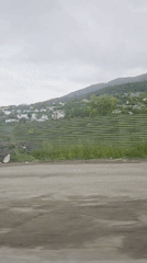 Dashcam footage documents scenic mountain road journey with passenger