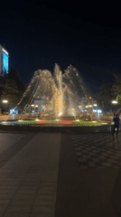 Batumi fountain lit up at night in a public square