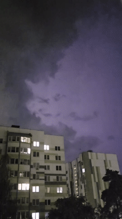 Lightning storm over Brest apartment blocks, August night
