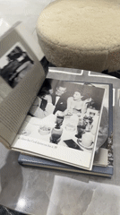 Dubai resident reads Sinatra magazine, walks in flowing garment