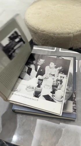 Dubai resident reads Sinatra magazine, walks in flowing garment