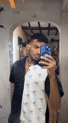 Venezuelan performer documents makeup routine before stage appearance