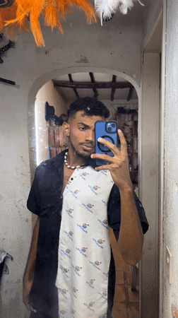 Venezuelan performer documents makeup routine before stage appearance