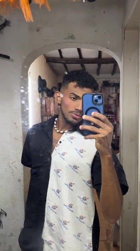Venezuelan performer documents makeup routine before stage appearance