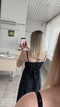 Woman photographs herself indoors and outdoors in Khimki