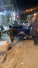 Boy boards three-wheeled vehicle on Quetta street