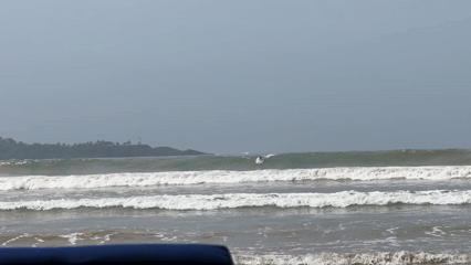 Surfers brave foggy conditions in Weligama waters