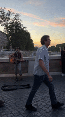 A Rome evening: Tiber at dusk, street performers, and local color