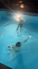 Evening pool gathering captured in Kokkino Chorio, Greece