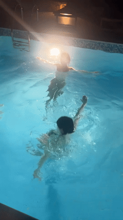 Evening pool gathering captured in Kokkino Chorio, Greece