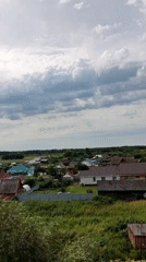 Aerial view of a quiet village nestled in green surroundings