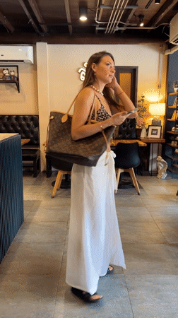 Woman in leopard print visits multiple cafes in Thailand