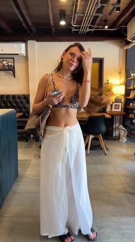 Woman in leopard print visits multiple cafes in Thailand