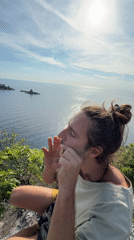 Musician plays jaw harp on seaside cliff in Montenegro