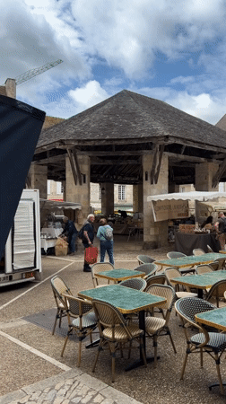Quiet morning at outdoor cafe in French town square
