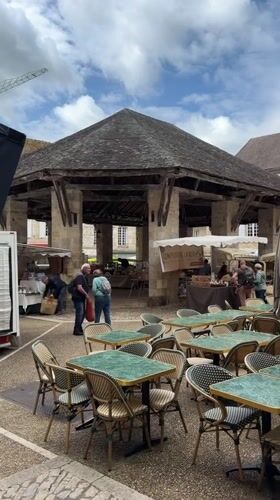 Quiet morning at outdoor cafe in French town square