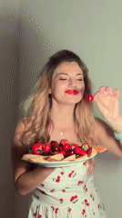 Woman holds fruit plate in Budva, Montenegro