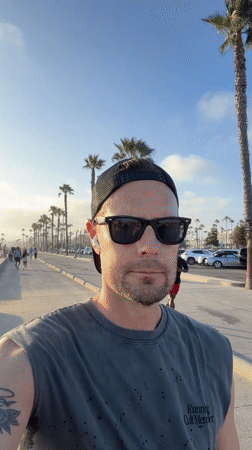 Santa Monica beachfront at golden hour, calm and open