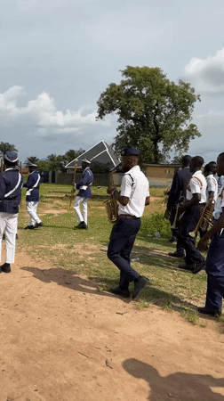 Youth marching band parades through Mararaba, Nigeria