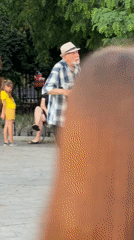 Outdoor dance gathering at a Odesa plaza on a rainy summer afternoon