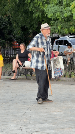 Outdoor dance gathering at a Odesa plaza on a rainy summer afternoon