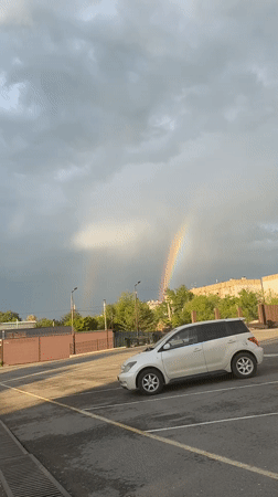 Double rainbow appears over Artyom, Russia parking area