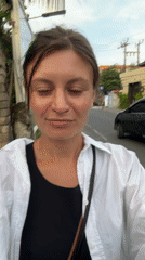 Woman records selfie video while walking in North Kuta