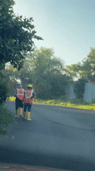 Utility workers and craftsman spotted in Indonesian neighborhood