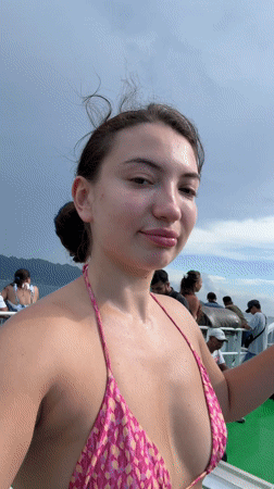 Woman takes selfie video on boat in Indonesia