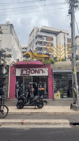 Pink-themed urban scenes documented across Tel Aviv morning