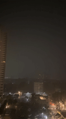 Heavy rain falls over Pattaya City at night
