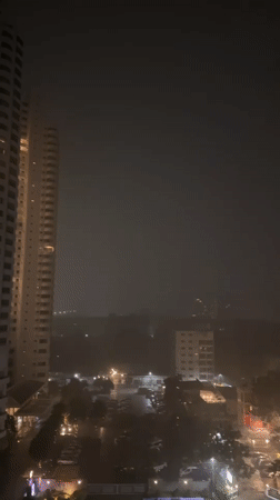 Heavy rain falls over Pattaya City at night