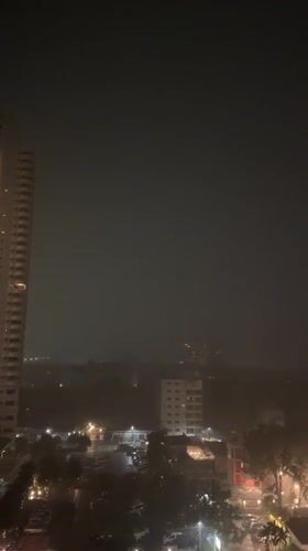 Heavy rain falls over Pattaya City at night