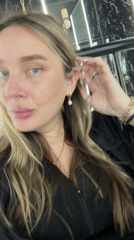 Woman takes selfies indoors in Moscow