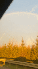 Rainbow spotted over autumn trees in Støvring, Denmark