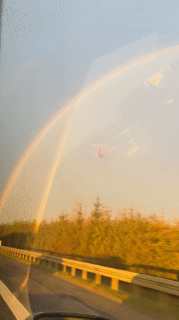 Rainbow spotted over autumn trees in Støvring, Denmark