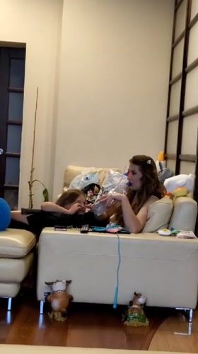 Two people rest together on sofa in Kemerovo