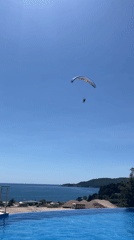 Purple parasailer spotted soaring above Montenegro waters