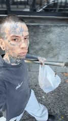 Tattooed man records selfie video while walking in Buenos Aires