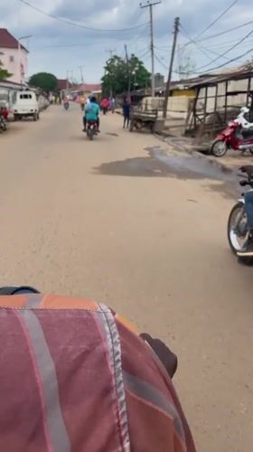 Market day in Keffi with fresh produce and motorcycle ride