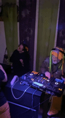 DJ performs at Moscow party with dancing crowd