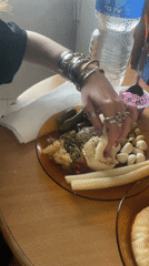 Woman enjoys traditional Middle Eastern breakfast in Petah Tikva