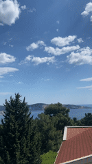 Tourist documents sunny afternoon visit to coastal Montenegro town