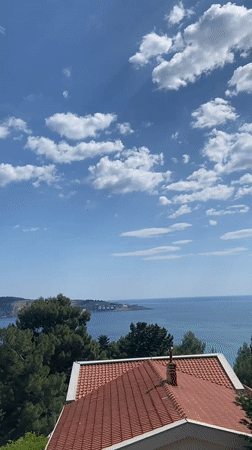 Tourist documents sunny afternoon visit to coastal Montenegro town